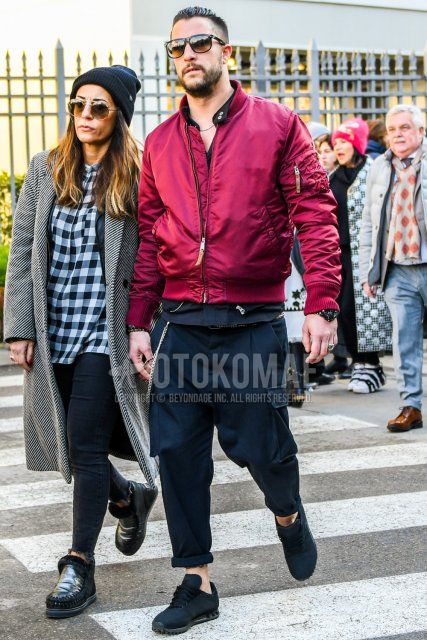 Men's coordinate and outfit with plain sunglasses, plain red MA-1, plain black cargo pants, and black low-cut sneakers.