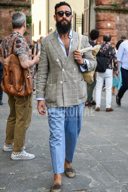 Men's coordinate and outfit with plain black sunglasses, gray checked tailored jacket, plain light blue shirt, plain blue ankle pants, and beige loafer leather shoes.