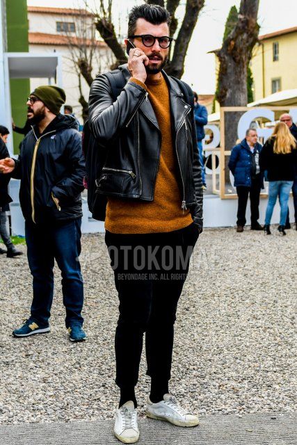 Men's coordinate and outfit with solid color sunglasses, solid color black rider's jacket, solid color brown sweater, solid color black winter pants (corduroy,velour), solid color black socks, white low-cut sneakers.