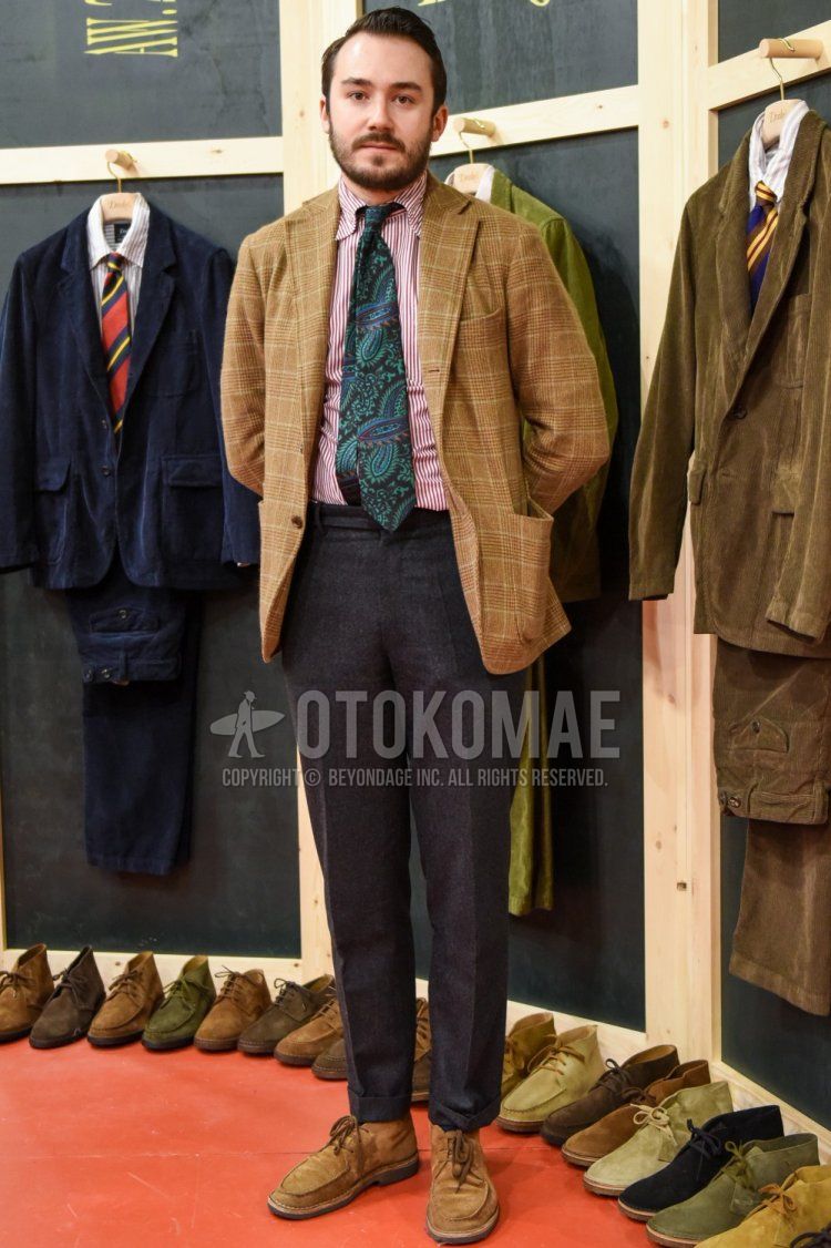 Men's fall/winter coordinate and outfit with beige checked tailored jacket, red striped shirt, plain gray slacks, plain gray cropped pants, beige chukka boots, and multi-colored tie tie.