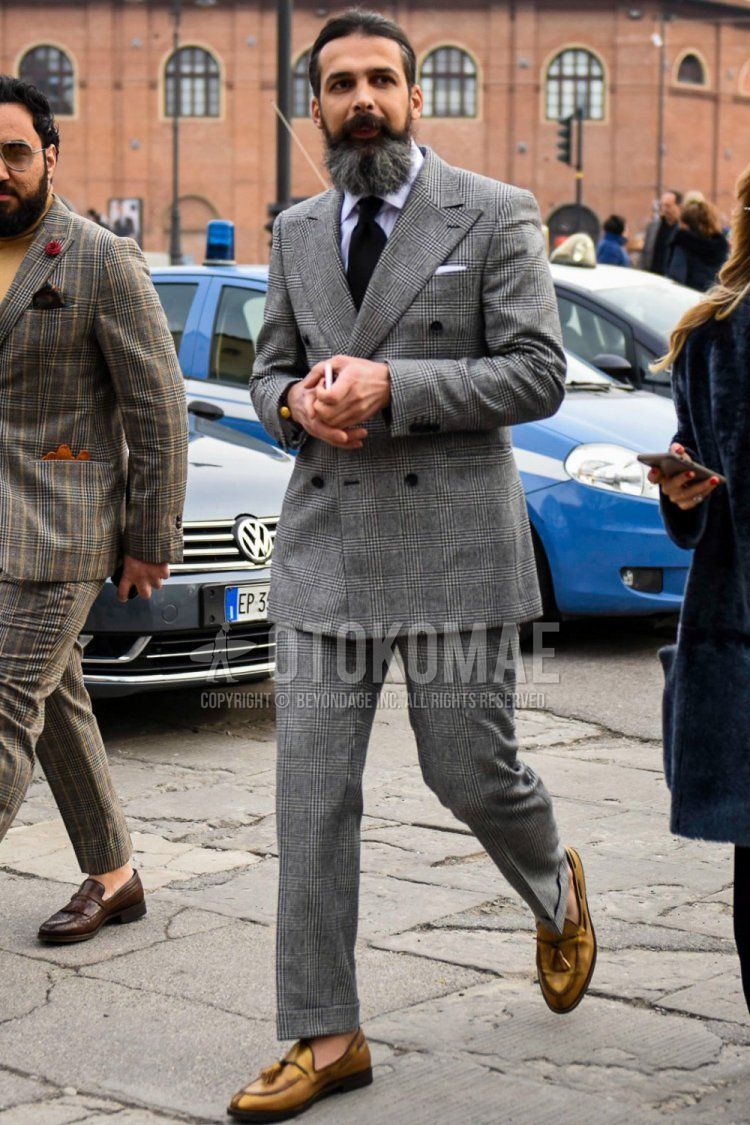 Men's coordination and outfit with plain white shirt, beige tassel loafer leather shoes, gray checked suit, and plain black tie.