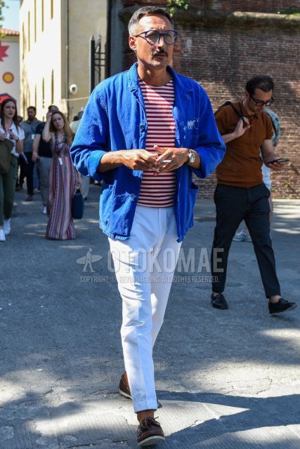 Men's coordinate and outfit with plain blue glasses, plain blue shirt jacket, white/red striped t-shirt, plain white cotton pants, and brown moccasins/deck shoes leather shoes.