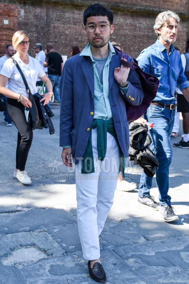 Men's coordinate and outfit with plain gold glasses, plain gray tailored jacket, plain green shirt, plain gray T-shirt, plain white cotton pants, and black loafer leather shoes.