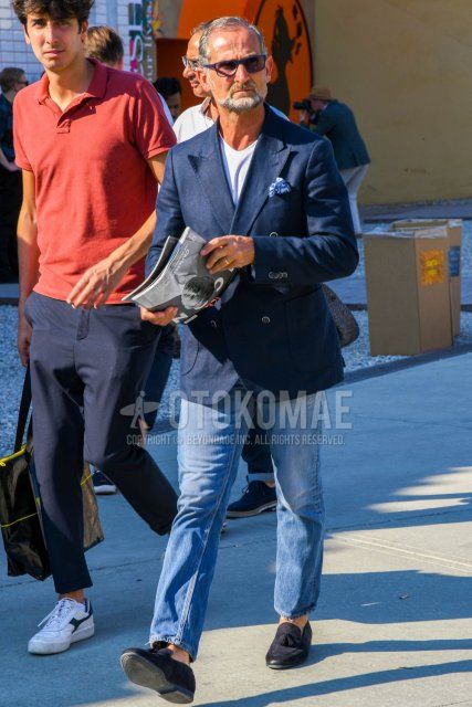 Men's coordinate and outfit with plain sunglasses, plain navy tailored jacket, plain white t-shirt, plain light blue denim/jeans, and navy tassel loafer leather shoes.