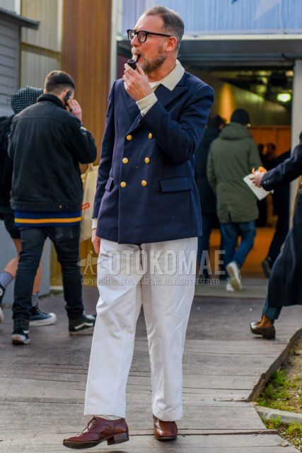 Men's fall/winter coordinate and outfit with plain black glasses, plain navy tailored jacket, plain beige shirt, plain white cotton pants, plain beige socks, and brown wingtip leather shoes.