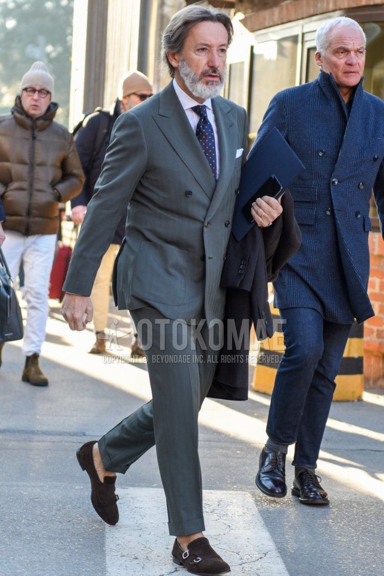 Men's spring and fall coordinate and outfit with plain white shirt, suede brown loafer leather shoes, gray striped suit and navy dot tie.
