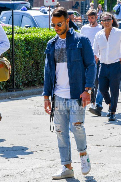 Men's coordinate and outfit with round plain silver sunglasses, plain blue shirt jacket, white top/inner t-shirt, plain light blue damaged jeans, and white low-cut sneakers.