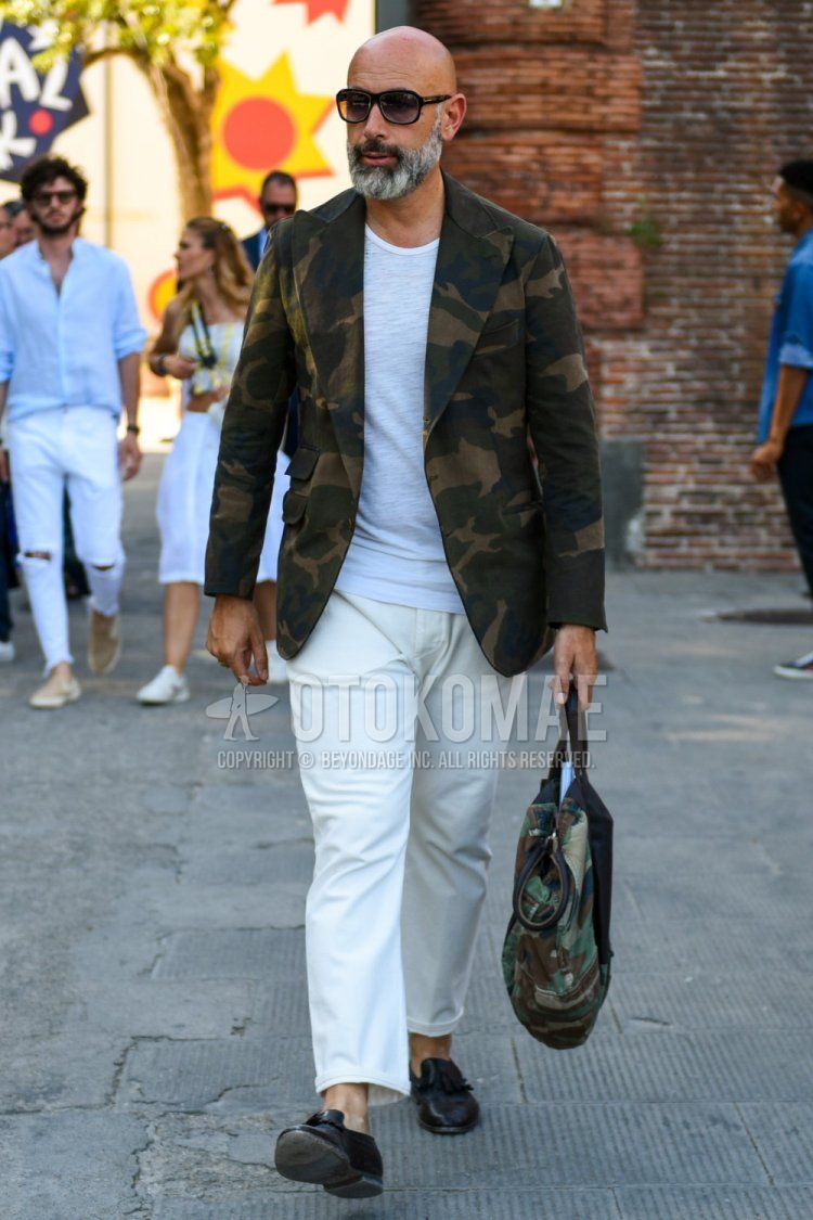 Solid black sunglasses, olive green/brown/beige camouflage tailored jacket, solid white t-shirt, solid white cotton pants, solid white ankle pants, black tassel loafer leather shoes, olive green/beige/brown camouflage briefcase/handbag Spring Men's summer/autumn coordination/outfits.