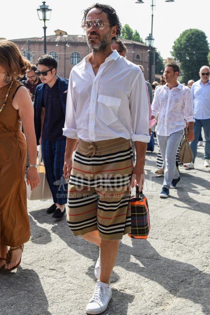 Teardrop gold plain sunglasses, plain white shirt, Burberry beige striped sweatpants, striped shorts, Adidas Stan Smith white low cut sneakers, olive green checked clutch/second bag/drawstring summer Men's Codes and Outfits.