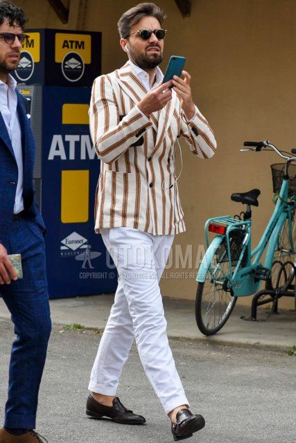 Men's spring, summer, and fall coordinate and outfit with plain black sunglasses, white and orange striped tailored jacket, plain white shirt, plain white cotton pants, and brown loafer leather shoes.