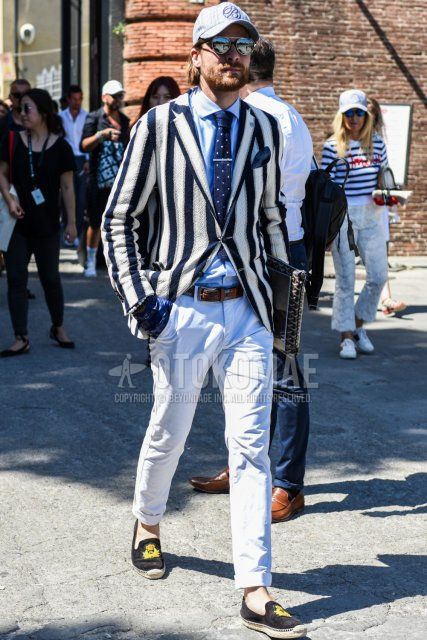 Gray one-pointed baseball cap, plain silver sunglasses, navy/white striped tailored jacket, plain light blue shirt, multi-colored plain leather belt, plain white cotton pants, black espadrilles, Goyard brown bag clutch/second bag/drawstring, navy dotted knit tie, spring/summer/fall men's coordinate and outfit.