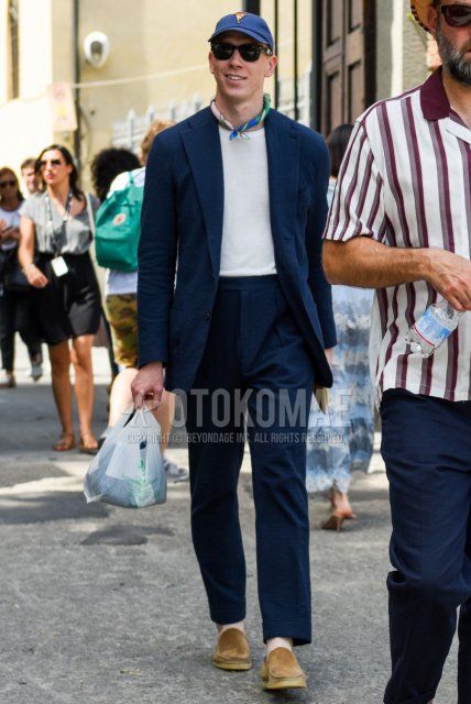 Men's spring/summer/fall coordinate and outfit with navy one-point baseball cap, plain black Wellington sunglasses, multi-colored plain bandana/neckerchief, knit plain white t-shirt, suede brown loafer leather shoes, and plain navy suit.