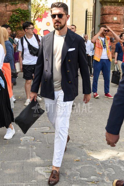 Men's spring/summer/autumn coordinate and outfit with brown tortoiseshell sunglasses, plain black tailored jacket, knit plain beige t-shirt, plain white cotton pants, brown tassel loafer leather shoes, black bag clutch/second bag/drawler.