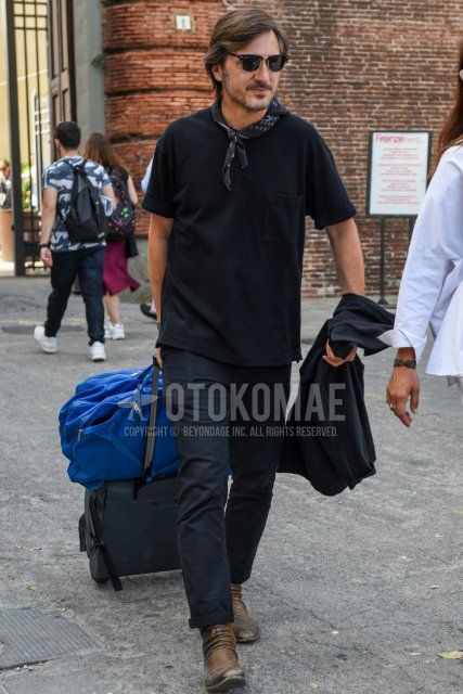 A summer men's outfit/coordination of plain black/gold sunglasses, plain black bandana/neckerchief, plain black t-shirt, plain black cotton pants, and brown boots.