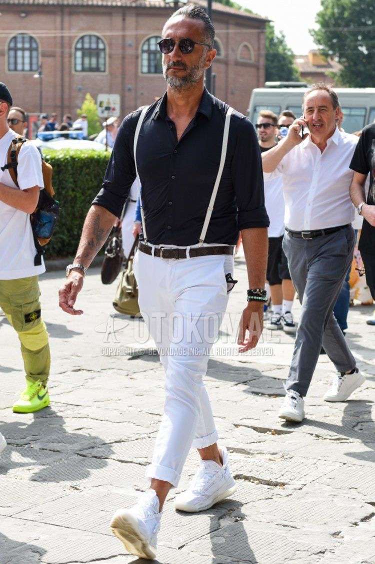 Men's spring, summer, and fall outfit with plain black sunglasses from Boston, plain black shirt, plain white suspenders, plain brown leather belt from Louis Vuitton, plain white cotton pants, and white high-cut sneakers.