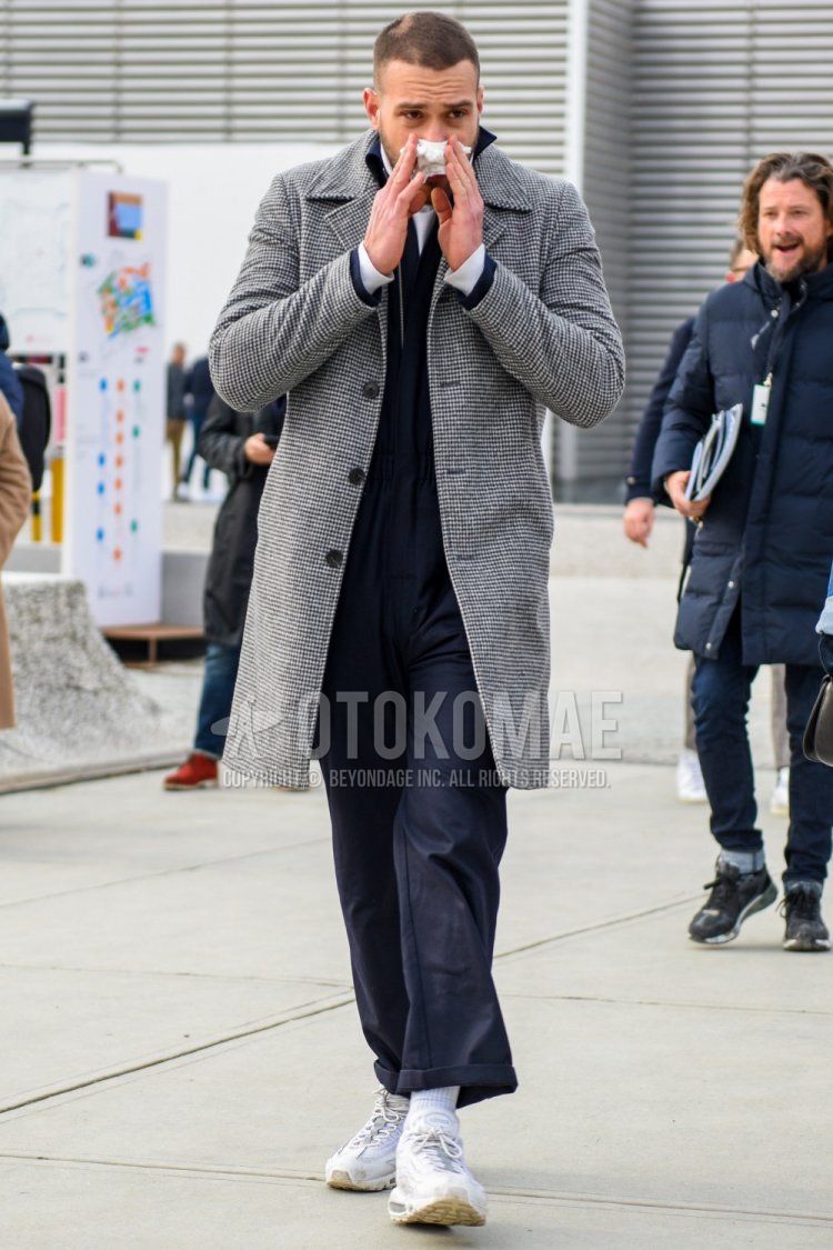 Men's fall/winter coordinate and outfit with gray checked stainless steel coat, plain navy jumpsuit, plain white socks, and Nike Air Max 95 white low-cut sneakers.