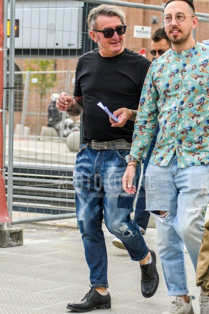 A summer men's coordinate and outfit with solid color sunglasses, solid color black t-shirt, black leather belt, solid color blue denim/jeans, and black plain toe leather shoes.