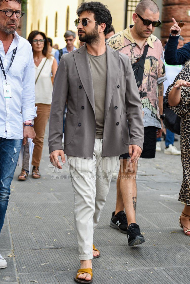 Men's spring, summer, and fall coordinate and outfit with plain gold sunglasses, plain gray tailored jacket, plain gray t-shirt, plain white cotton pants, and yellow shower sandals.