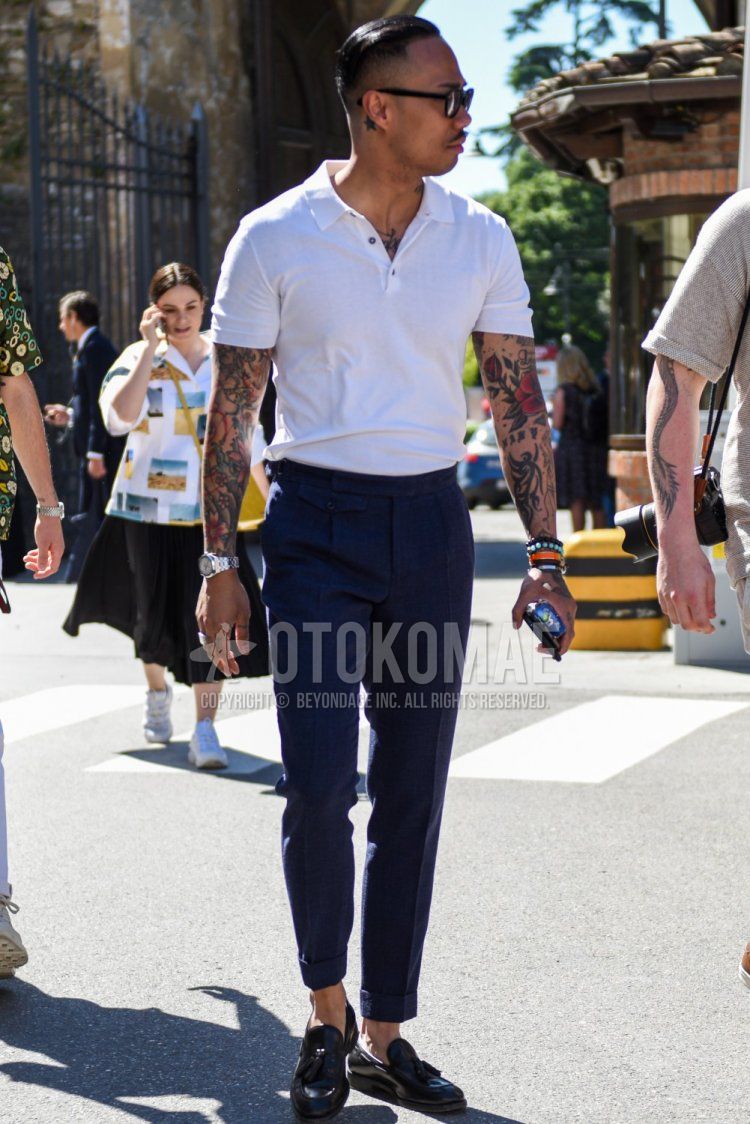 Men's summer coordinate and outfit with plain black sunglasses, plain white polo shirt, plain gray slacks, plain ankle pants, and black tassel loafer leather shoes.