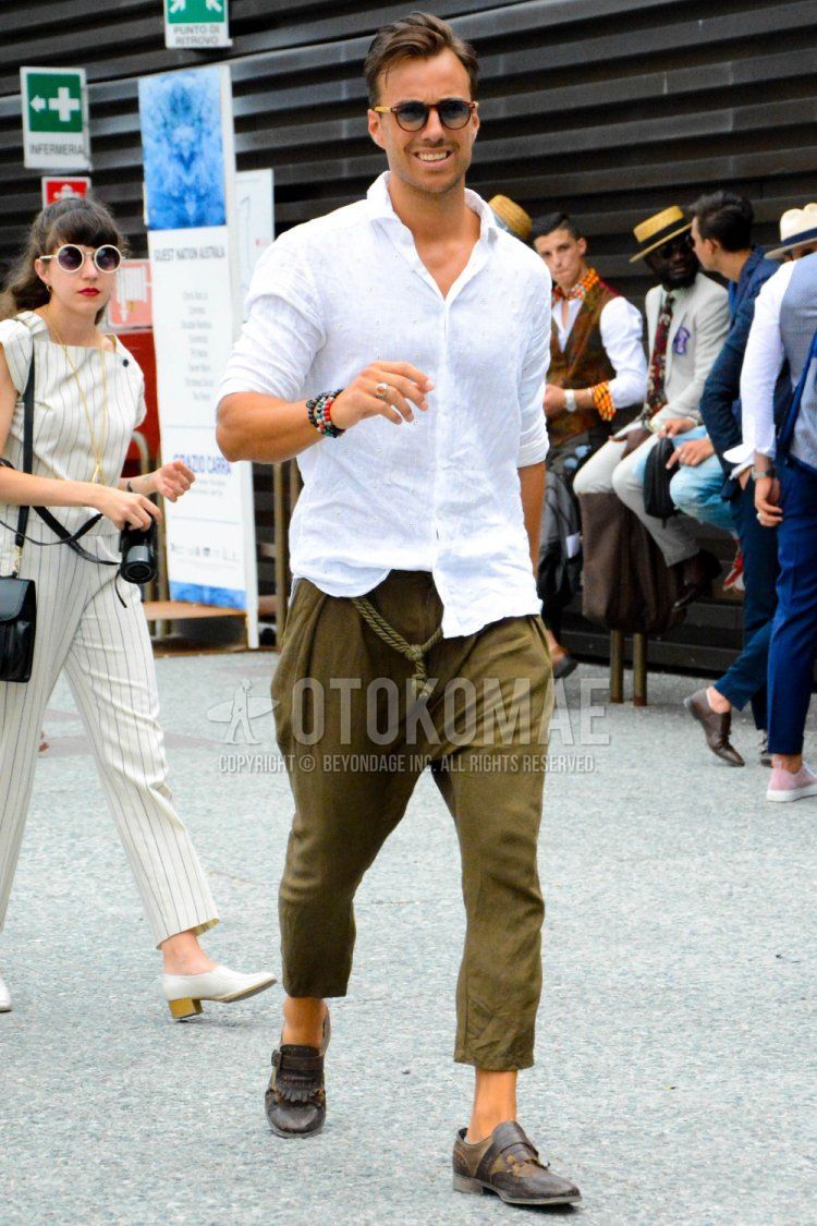 Men's spring and summer coordinate and outfit with plain brown sunglasses, plain white linen shirt, plain brown chinos, plain brown cropped pants, and brown monk shoes leather shoes.
