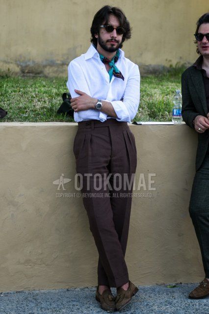 Men's spring, summer, and fall coordinate and outfit with black tortoiseshell sunglasses, solid light blue bandana/neckerchief, solid white shirt, solid brown beltless pants, and brown tassel loafer leather shoes.