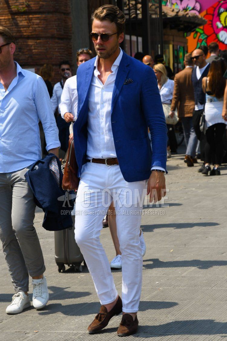 Men's spring, summer, and fall coordinate and outfit with tortoiseshell sunglasses, plain blue tailored jacket, plain white shirt, plain brown leather belt, plain mesh belt, plain white cotton pants, brown tassel loafers leather shoes, and suede shoes leather shoes.
