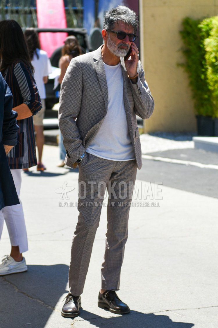 Men's spring, summer, and fall coordination and outfit with plain black sunglasses, plain white T-shirt, brown plain-toe leather shoes, and plain gray suit.