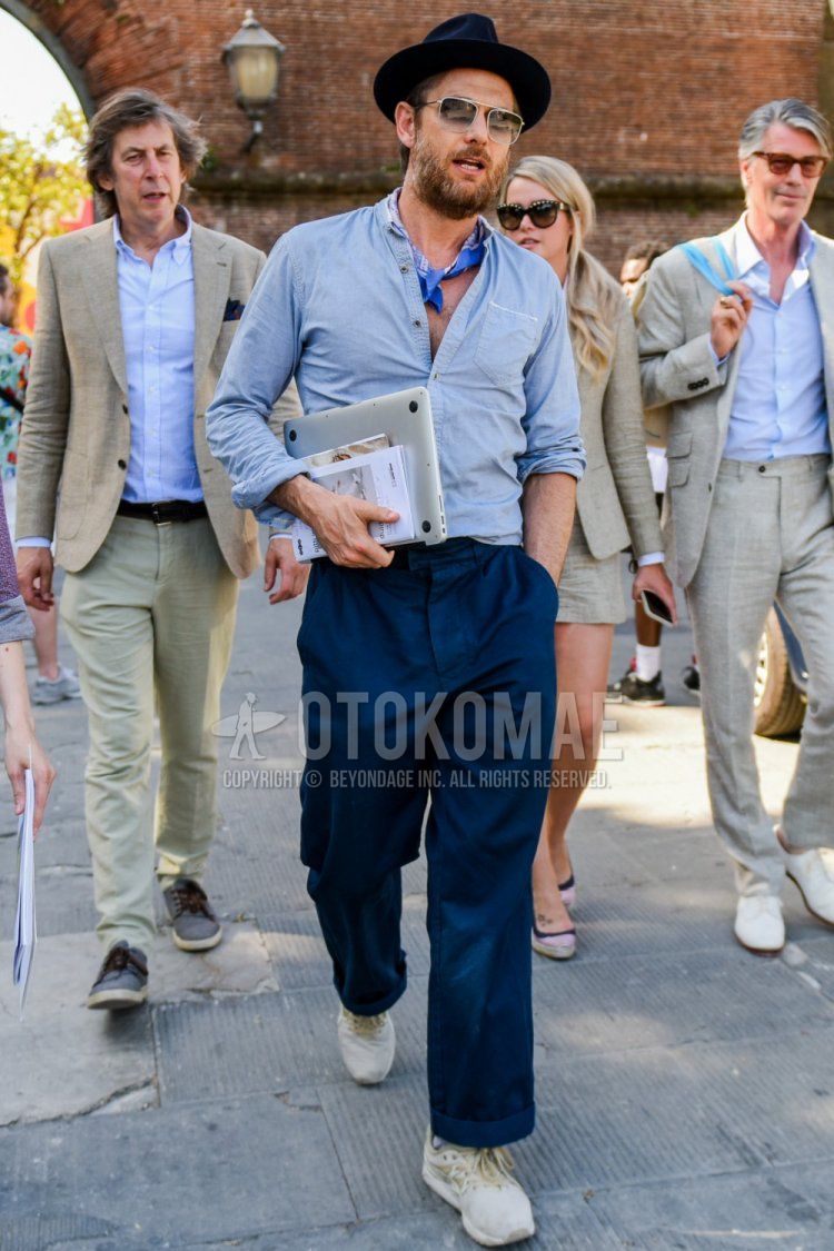 Men's spring/summer coordinate and outfit with plain black hat, plain silver sunglasses, blue stole bandana/neckerchief, plain gray shirt with band collar, plain navy chinos, and beige low-cut sneakers.