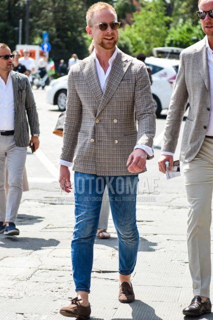 Men's spring/summer/autumn coordination and outfit with clear/black solid color sunglasses, beige/gray checked tailored jacket, blue solid color denim/jeans, suede brown tassel loafer leather shoes.