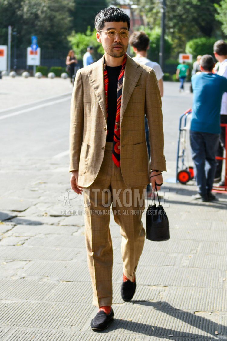Men's spring/autumn coordinate and outfit with plain yellow glasses, red stole scarf/stall, plain black t-shirt, plain red socks, black loafer leather shoes, and brown checked suit.