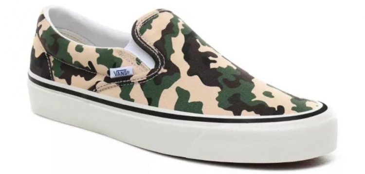 Camouflage patterned Vans Classic slip-on for active feet on the street and outdoor scenes.