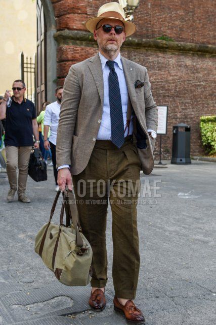 Solid beige hat, solid brown sunglasses from Boston, solid gray-brown tailored jacket, solid light blue shirt, solid brown beltless pants, solid brown slacks, brown tassel loafer leather shoes, solid gray-olive green Boston bag, Spring, summer, and fall men's coordinate and outfit with navy check tie.