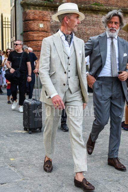 Men's spring, summer, and fall coordinate and outfit with plain beige hat, gray stole bandana/neckerchief, plain white shirt, brown tassel loafer leather shoes, and plain beige three-piece suit.