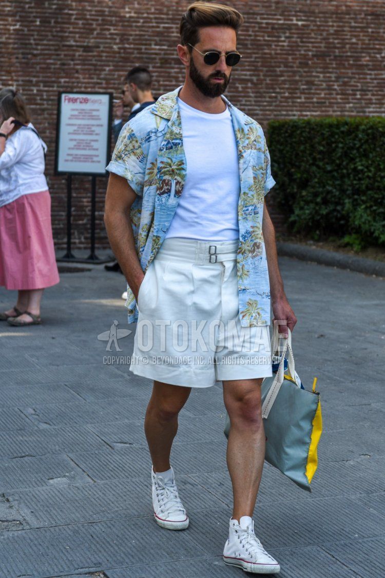 Summer men's coordinate and outfit with plain gold/black sunglasses, plain white t-shirt, light blue botanical shirt, plain white beltless pants, and white high-cut Converse sneakers.