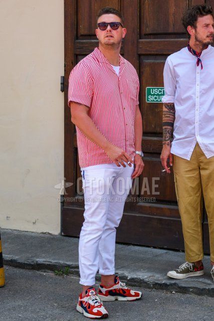 Men's summer coordinate and outfit with plain black sunglasses, red striped shirt, plain white t-shirt, plain white cotton pants, and Adidas Yung-1 red low-cut sneakers.