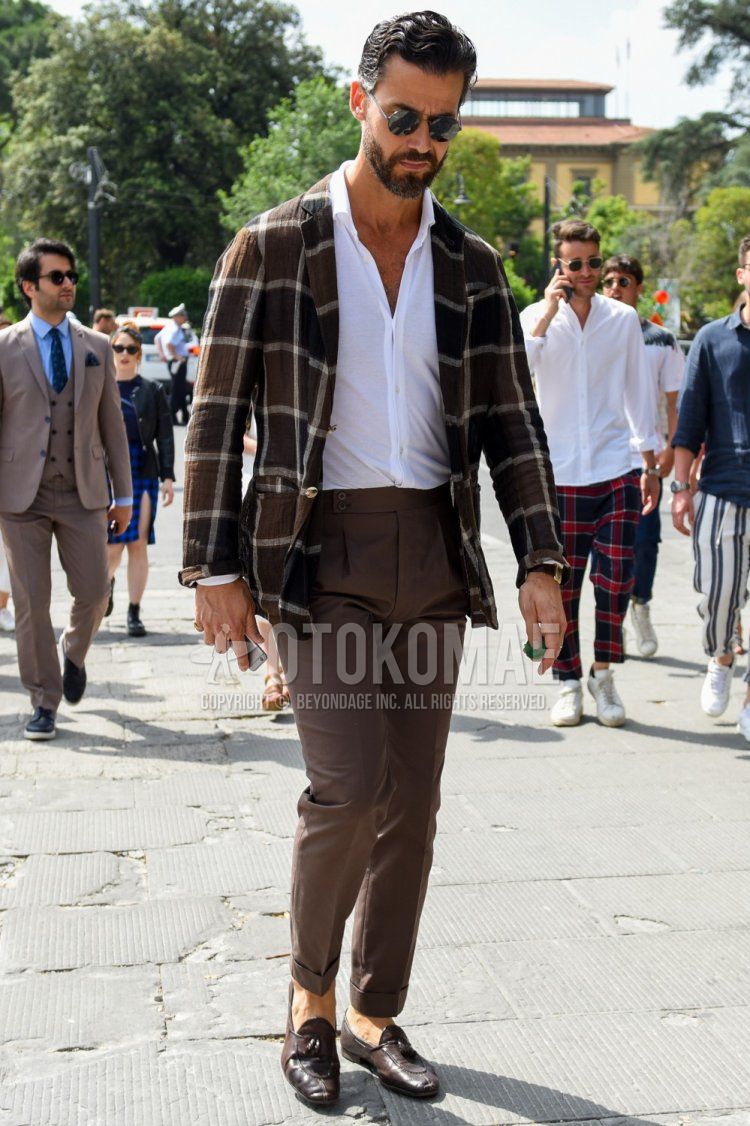 Men's spring, summer, and fall coordinate and outfit with plain black sunglasses, brown checked tailored jacket, plain white linen shirt, plain brown beltless pants, and brown tassel loafer leather shoes.