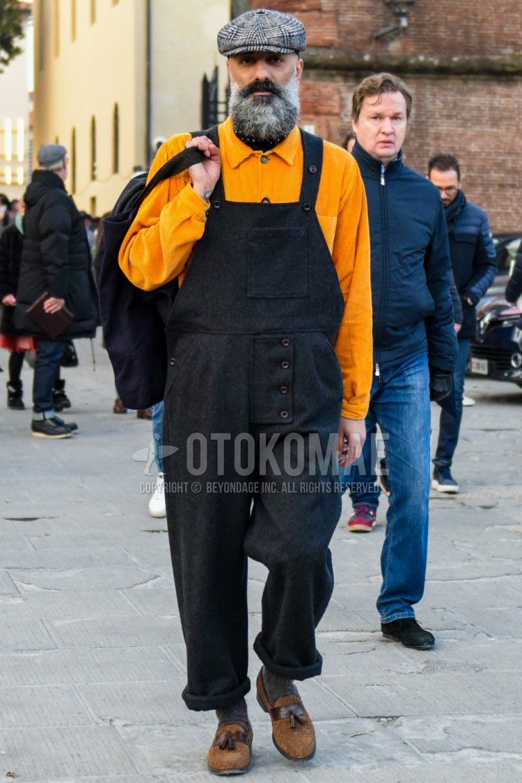 Men's spring and fall coordinate and outfit with glen check check cap, plain yellow shirt jacket, overalls plain black jumpsuit, plain gray socks, and brown loafer leather shoes.