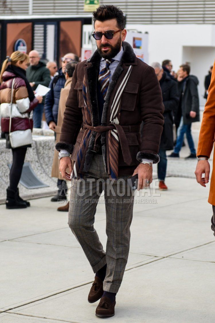 Boston brown tortoiseshell sunglasses, brown striped scarf/stole, plain brown safari jacket, plain brown leather jacket (not riders), gray striped shirt, gray checked slacks, plain purple socks, suede Brown tassel loafer leather shoes, multi-colored regimental tie, men's fall/winter outfit.