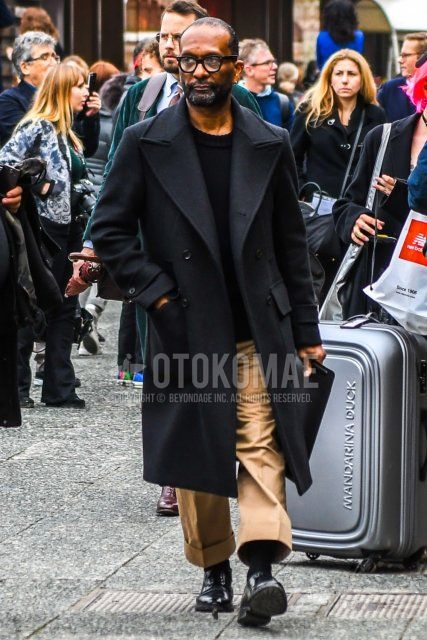 Men's fall/winter coordinate and outfit with solid color glasses, solid color black chester coat, solid color black sweater, solid color beige chinos, solid color wide pants, solid color black socks, and black plain toe leather shoes.