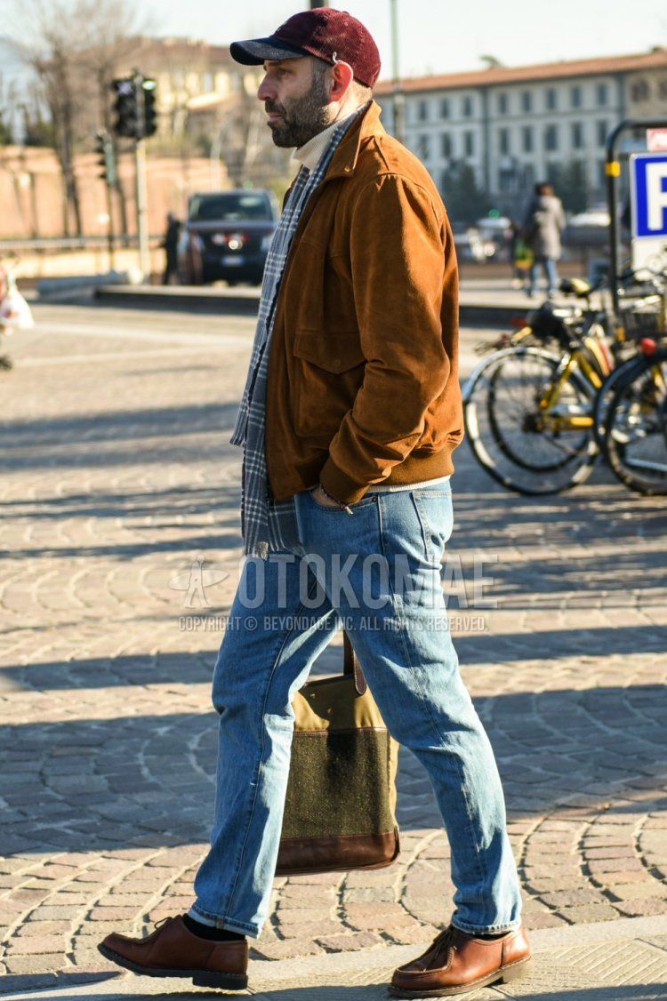 Men's fall/winter outfit with plain red baseball cap, gray checked scarf/stall, plain brown leather jacket (not rider's), plain white turtleneck knit, plain blue denim/jeans, plain black socks, and brown Tyrolean leather shoes. Outfit.