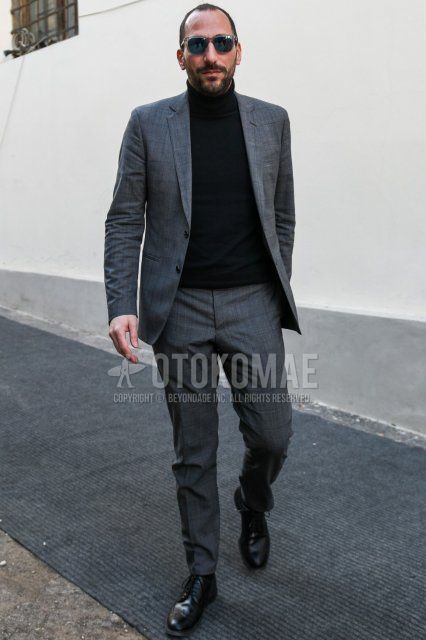 Men's spring and fall outfit with Wellington clear plain sunglasses, plain black turtleneck knit, black wingtip leather shoes, black brogue shoes leather shoes, and gray checked suit.