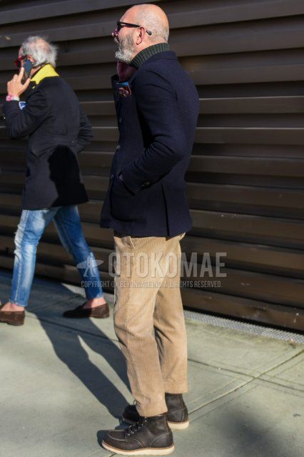Men's fall/winter coordinate and outfit with plain black sunglasses, plain navy tailored jacket, plain gray turtleneck knit, solid beige winter pants (corduroy,velour), solid beige cropped pants, and black work boots.