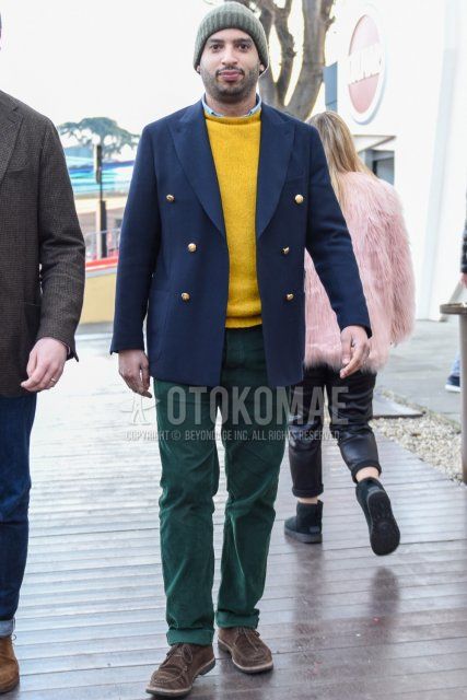 Men's spring/autumn coordinate and outfit with solid gray knit cap, solid navy tailored jacket, solid yellow sweater, solid light blue shirt, solid green winter pants (corduroy, velour), and suede brown boots.