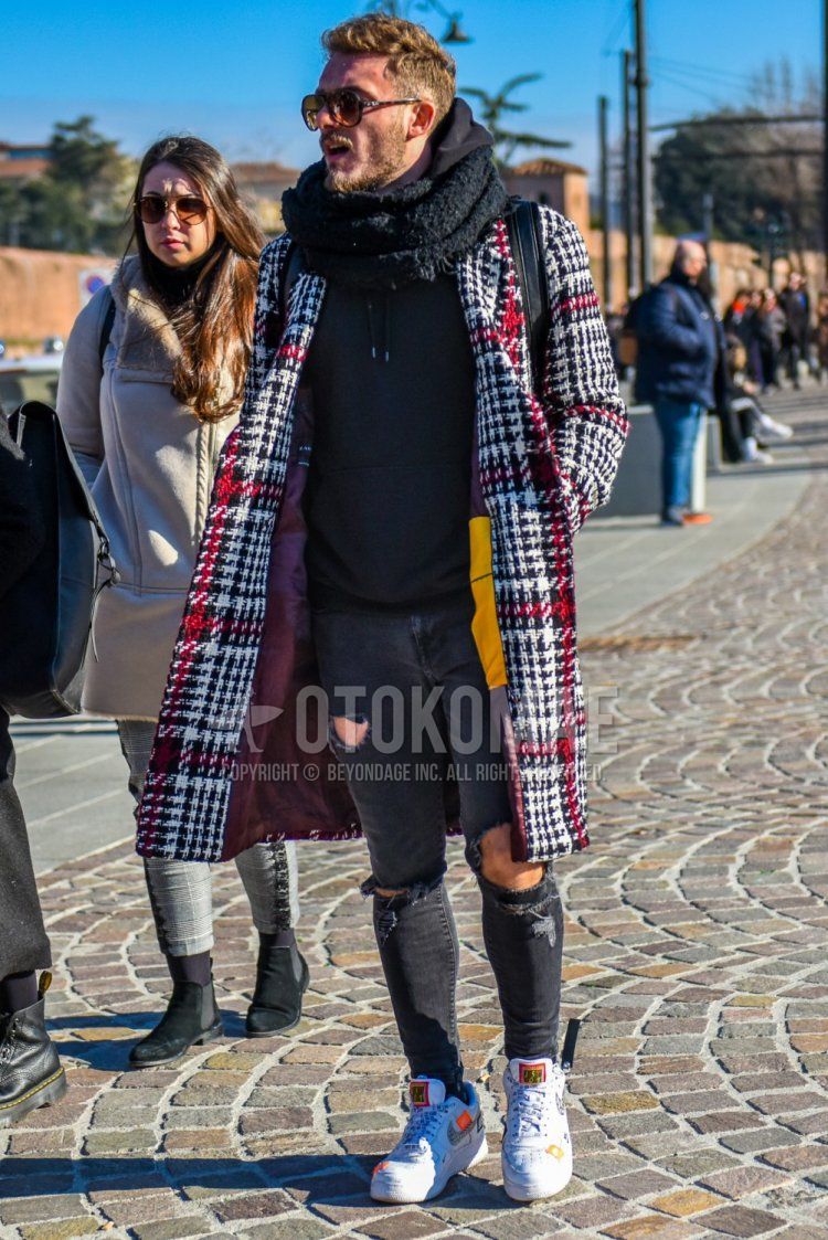 Winter men's coordinate and outfit with brown tortoiseshell sunglasses, solid black scarf/stall, white, red and black checked chester coat, dark gray solid color hoodie, gray solid color damaged jeans, Nike Air Force 1 white low-cut sneakers.