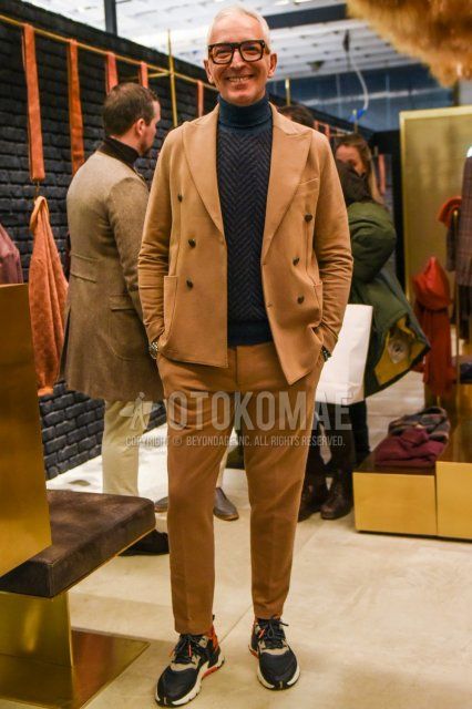 Men's spring and fall coordinate and outfit with plain black glasses, plain gray turtleneck knit, multi-colored high-cut sneakers, and plain beige suit.
