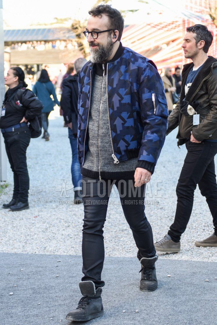 Men's fall/winter coordinate and outfit with plain black glasses, navy outerwear MA-1, plain gray cardigan, dark gray plain skinny pants, and gray high-cut sneakers.
