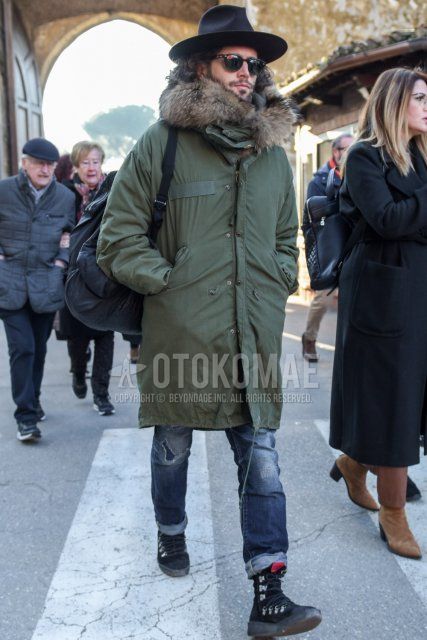 Men's fall/winter coordinate and outfit with plain black hat, plain black Boston sunglasses, plain olive green mod coat, plain gray damaged jeans, and black boots.
