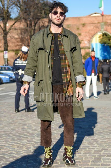Men's fall/winter coordinate and outfit with plain silver sunglasses, plain olive green stainless steel collar coat, multi-colored checked shirt, plain black t-shirt, plain brown winter pants (corduroy,velour), plain brown cropped pants and brown boots.