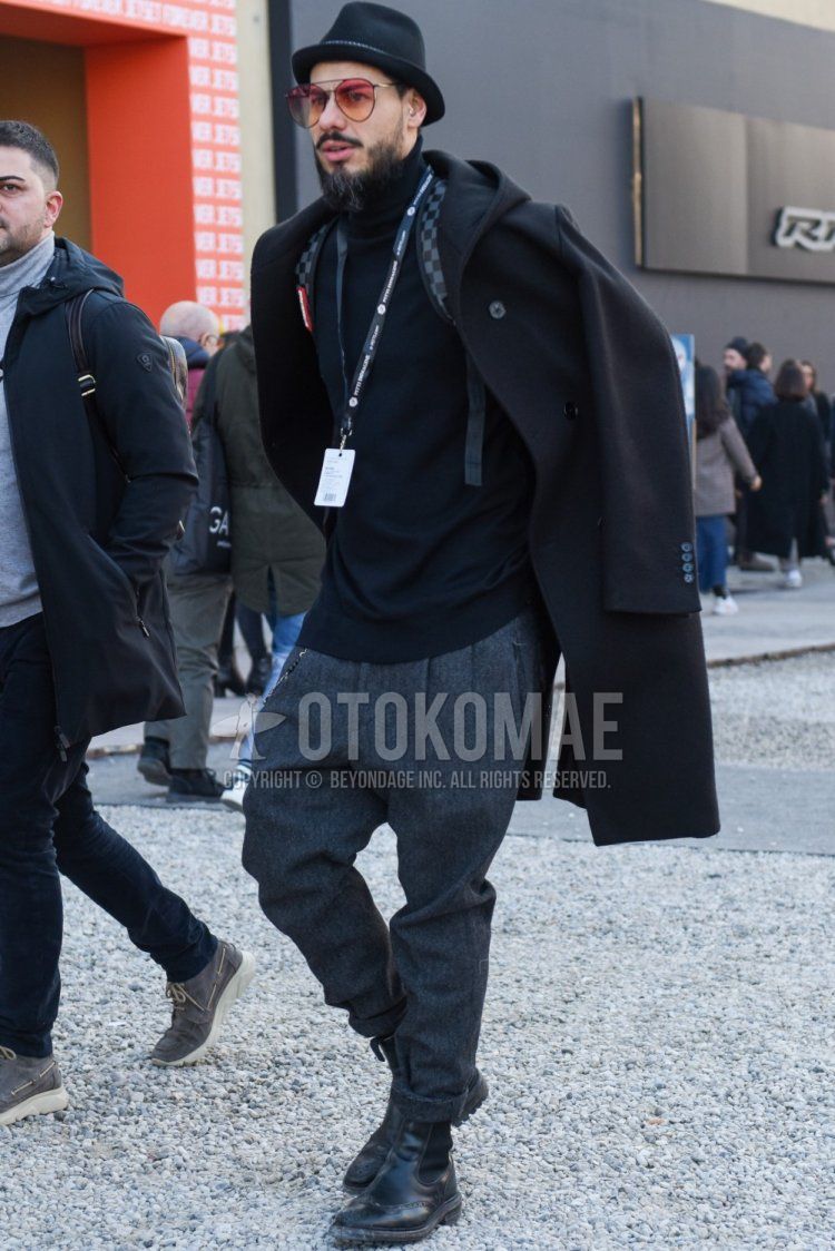 Men's fall/winter outfit/coordination with solid black hat, solid black sunglasses with teardrops, dark gray solid hooded coat, dark gray solid turtleneck knit, solid gray slacks, solid gray pleated pants, and black side gore boots.