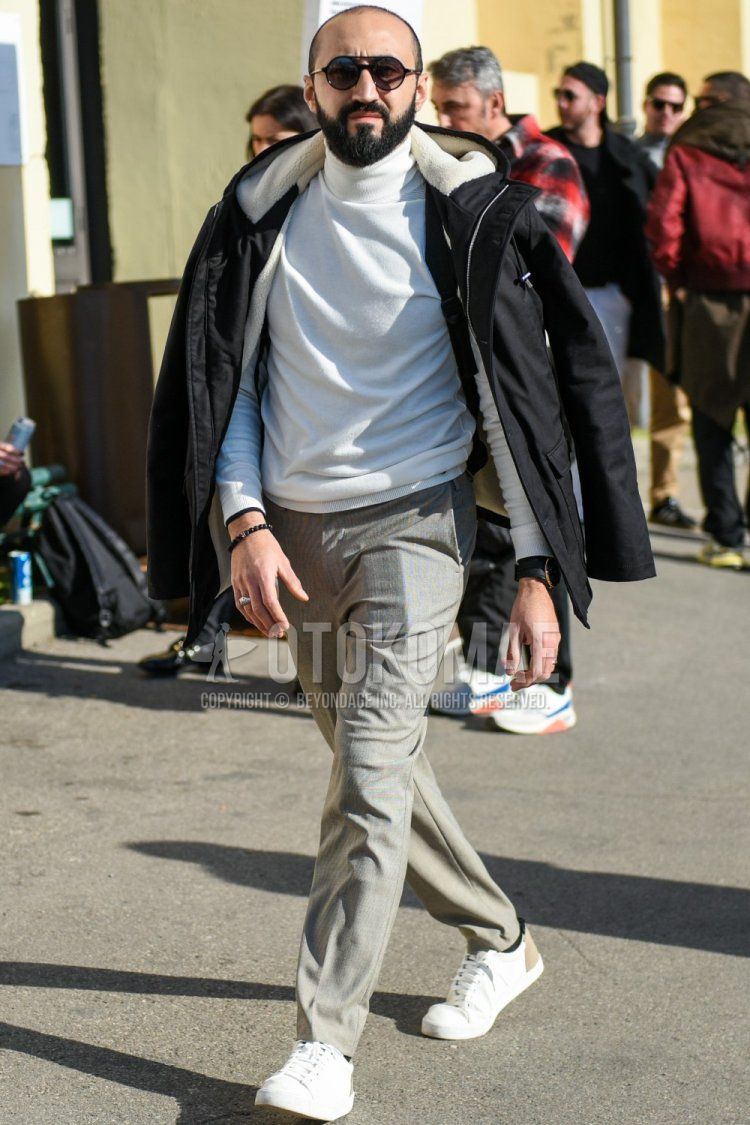 Men's fall/winter coordinate and outfit with plain black sunglasses, plain black hooded coat, plain white turtleneck knit, plain gray slacks, plain gray ankle pants, and white low-cut sneakers.